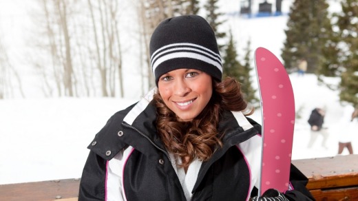 A snowboarder takes a break at a ski resort in Utah.