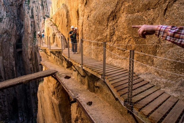 Tourists walk along the 'El Caminito del Rey' (King's Little Path) footpath in Malaga, Spain. 'El Caminito del Rey', ...