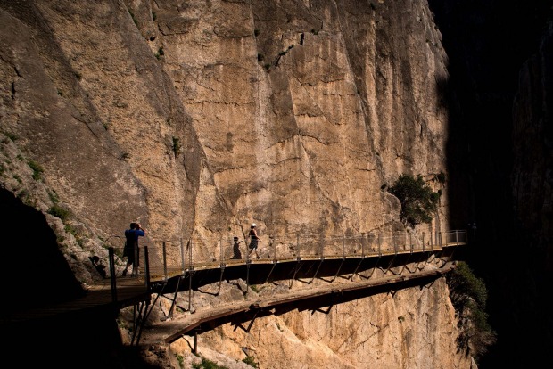 Tourists walk along the 'El Caminito del Rey' (King's Little Path) footpath in Malaga, Spain. 'El Caminito del Rey', ...