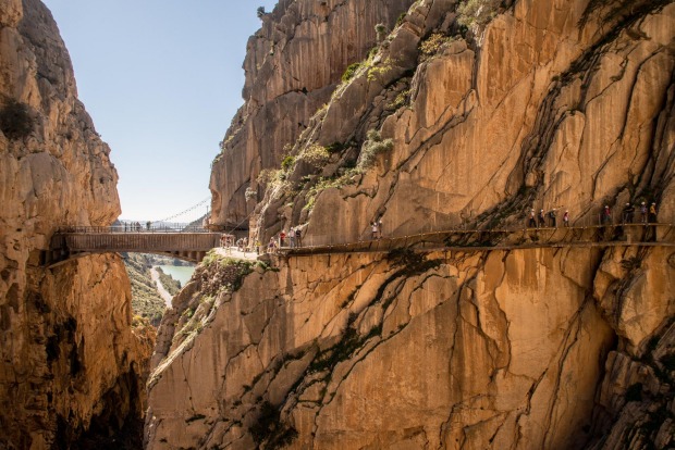 Tourists walk along the 'El Caminito del Rey' (King's Little Path) footpath in Malaga, Spain. 'El Caminito del Rey', ...