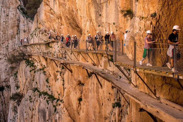 Tourists walk along the 'El Caminito del Rey' (King's Little Path) footpath in Malaga, Spain. 'El Caminito del Rey', ...