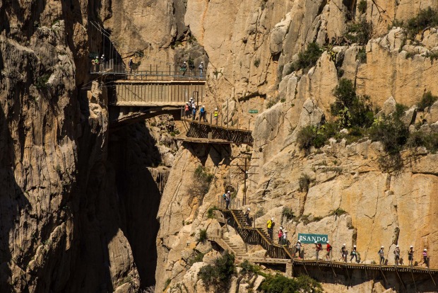 Tourists walk along the 'El Caminito del Rey' (King's Little Path) footpath in Malaga, Spain.