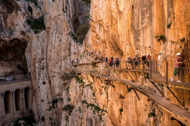 Tourists walk along the 'El Caminito del Rey' (King's Little Path) footpath in Malaga, Spain. 'El Caminito del Rey', ...