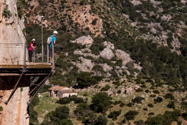 Tourists enjoy the view from the 'El Caminito del Rey' (King's Little Path) footpath in Malaga, Spain.