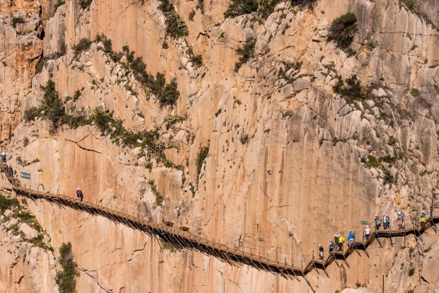 Tourists walk along the 'El Caminito del Rey' (King's Little Path) footpath in Malaga, Spain. 'El Caminito del Rey', ...