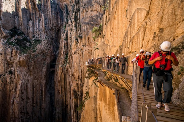 Tourists walk along the 'El Caminito del Rey' (King's Little Path) footpath in Malaga, Spain. 'El Caminito del Rey', ...