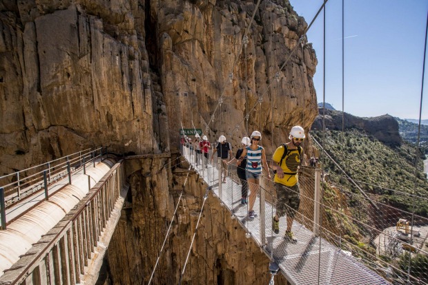 Tourists walk along the 'El Caminito del Rey' (King's Little Path) footpath in Malaga, Spain. 'El Caminito del Rey', ...