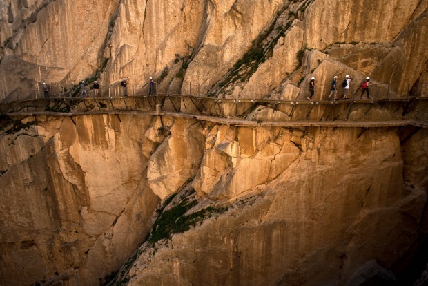 Tourists walk along the 'El Caminito del Rey' (King's Little Path) footpath in Malaga, Spain. 'El Caminito del Rey', ...