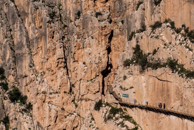 Tourists walk along the 'El Caminito del Rey' (King's Little Path) footpath in Malaga, Spain.