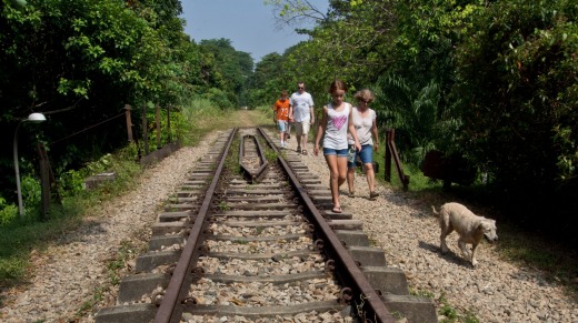 A family enjoys the tranquillity of the old railway track near Bukit Timah Nature Reserve.